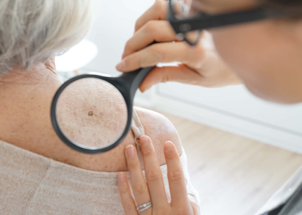 doctor examining woman's back.